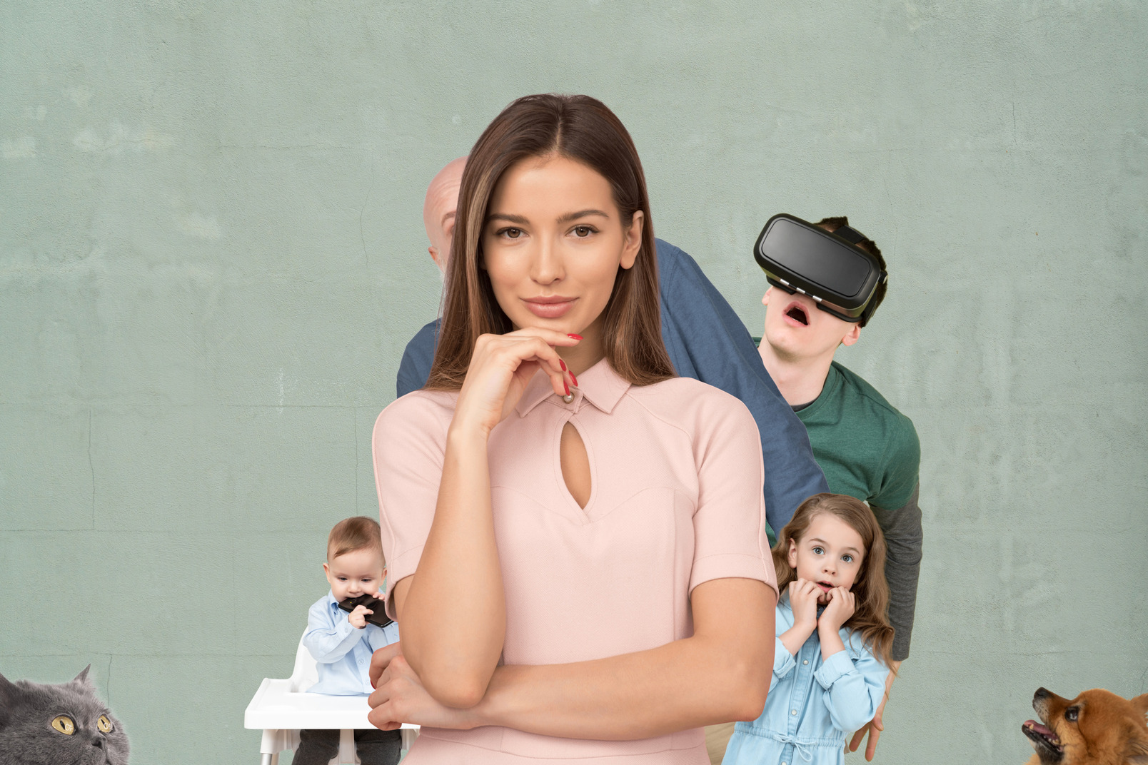 A man, baby girl and teenager with virtual reality glasses hide behind a beautiful smiling woman, cat and spitz-dog looking to her from a side and a little boy biting a wallet.