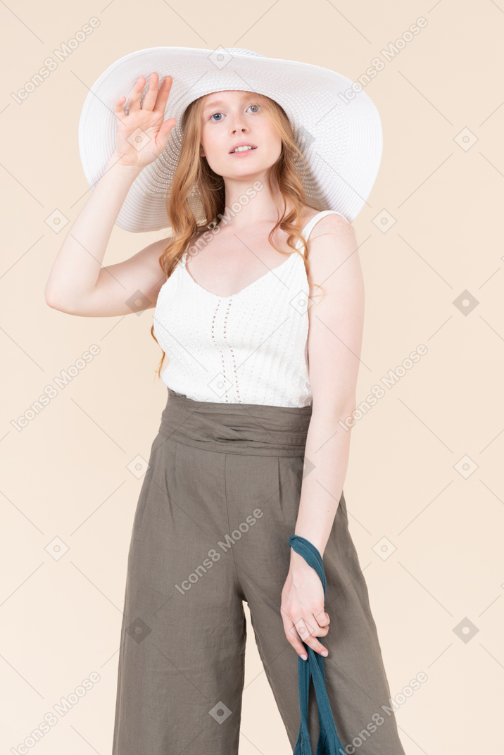 Welcoming summer time with white hat accessory