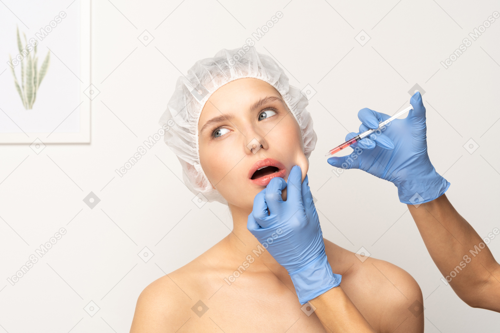 Young woman having her face injected with botox