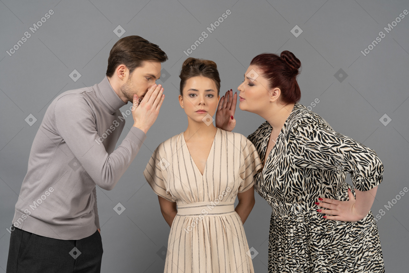 Young man and young woman gossiping in indifferent woman's ears