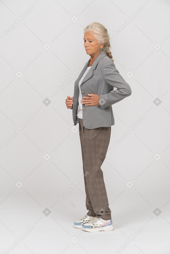 Old lady in suit standing in profile