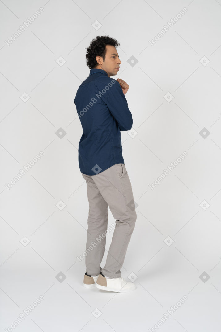 Side view of a man in casual clothes thinking