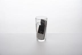 Cell phone in a glass of water