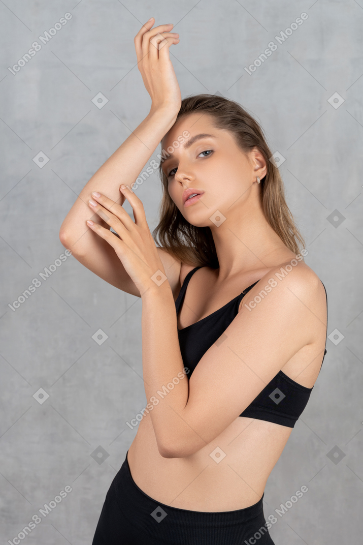 Beautiful woman posing with hands near her face