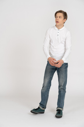 Young man in casual clothes standing