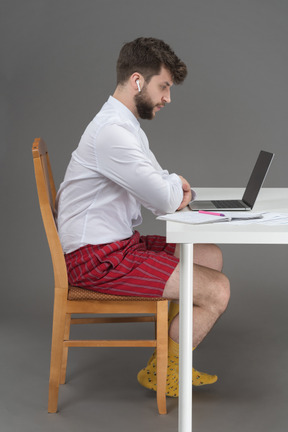 Businessman holding online meeting during pandemic