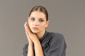 Front view of a young woman in a jumpsuit with clean skin