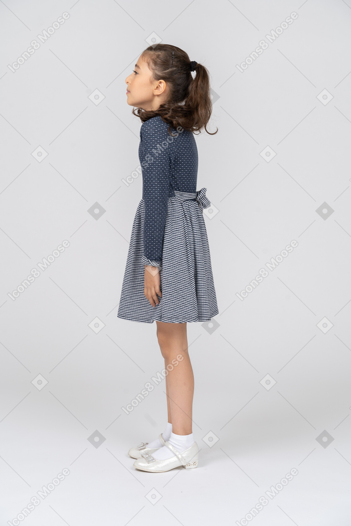 Side view of a girl slouching slightly