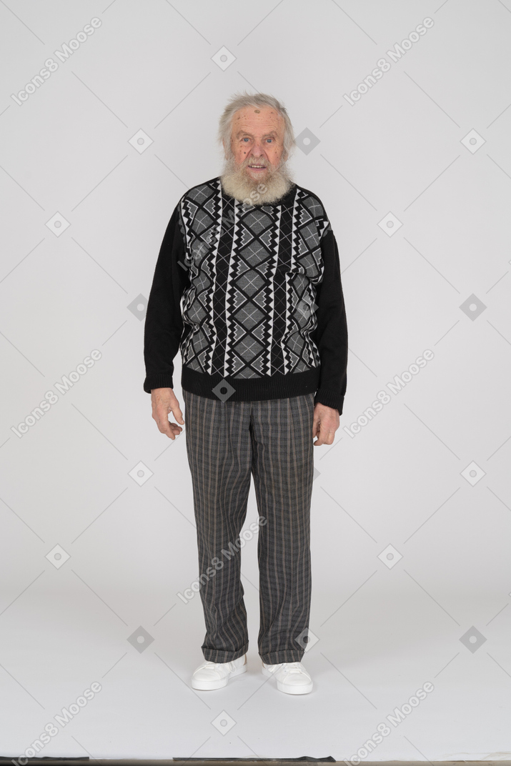 Front view of elderly man standing with neutral facial expression