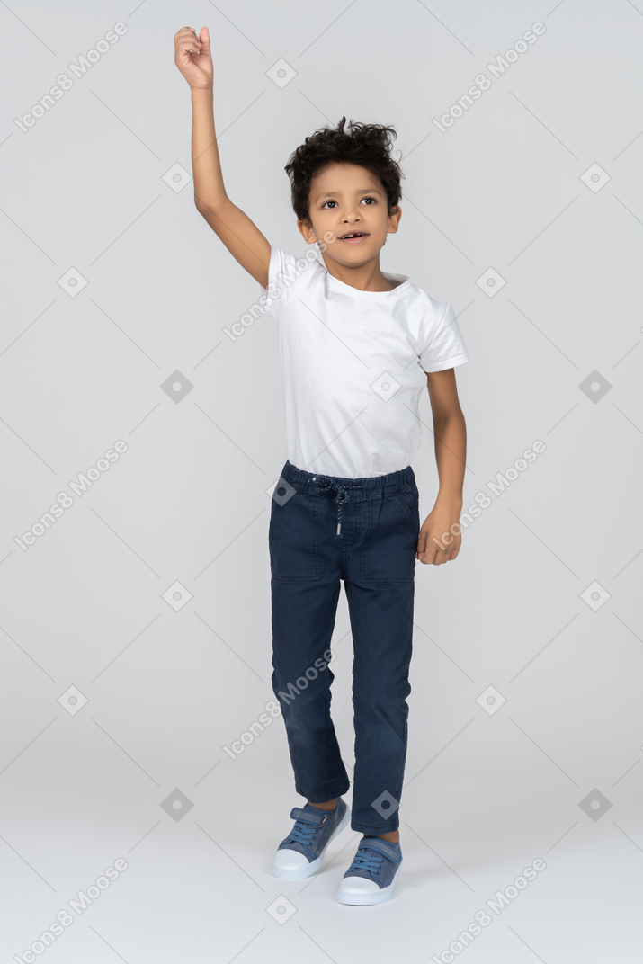 A boy raising his hand