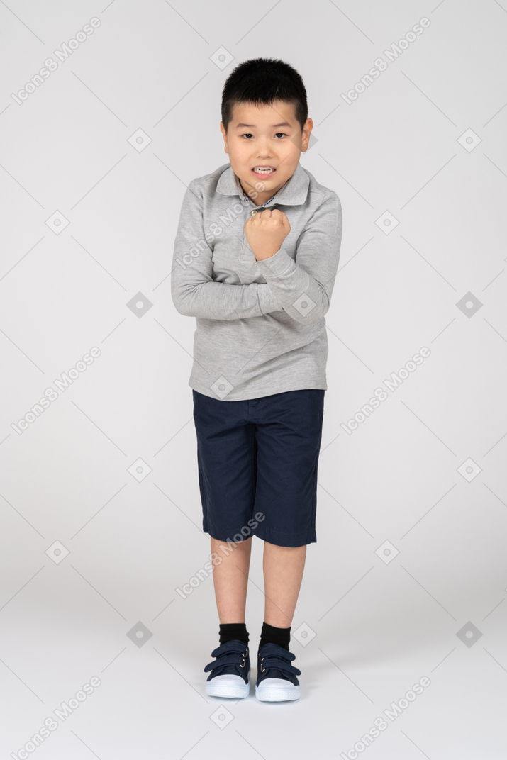 Boy showing fist