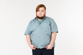 A fat man looking upset and unhappy