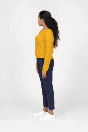 Side view of a girl in casual clothes looking aside