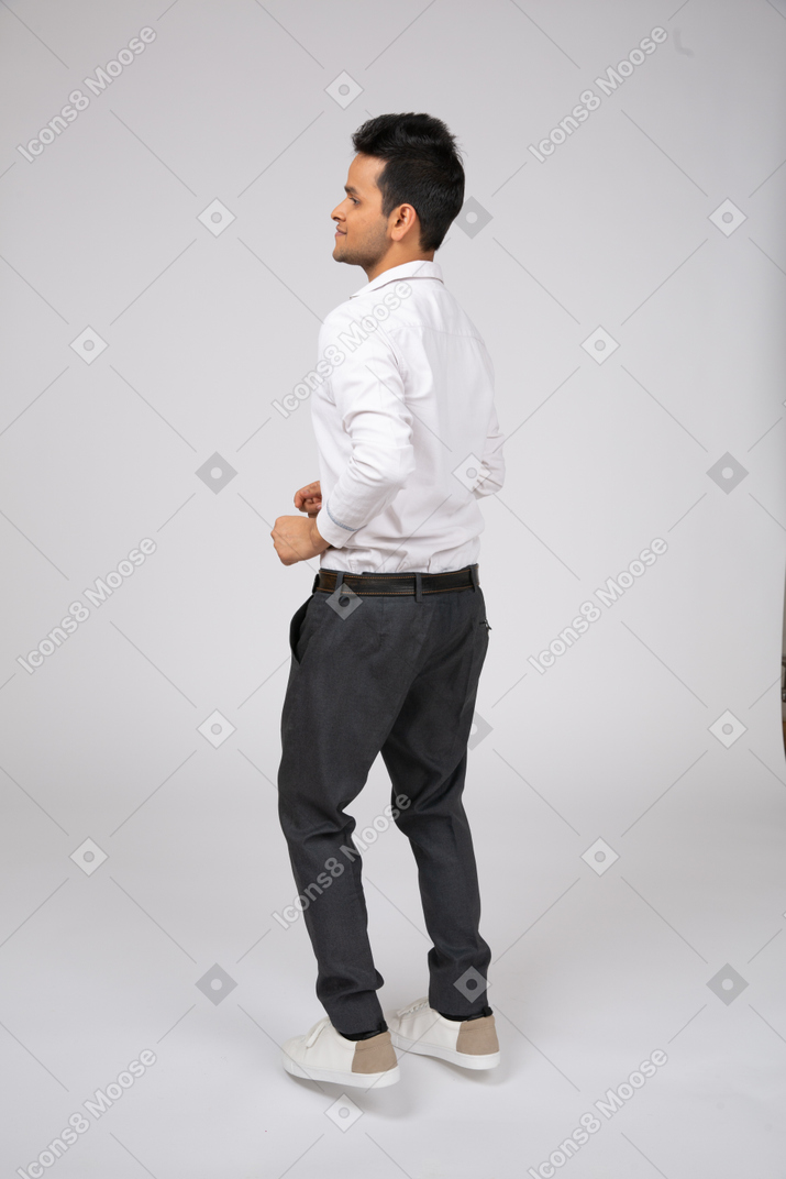 Man in white shirt walking