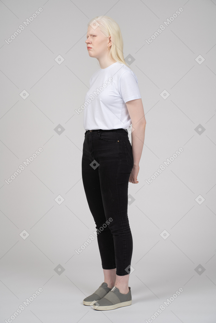 Teenage girl in casual clothes looking upset