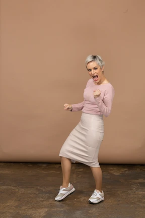 Front view of a happy woman in casual clothes