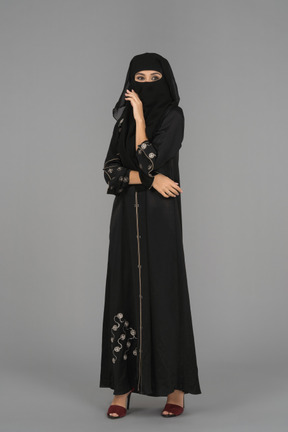 A muslim woman wearing a niqab