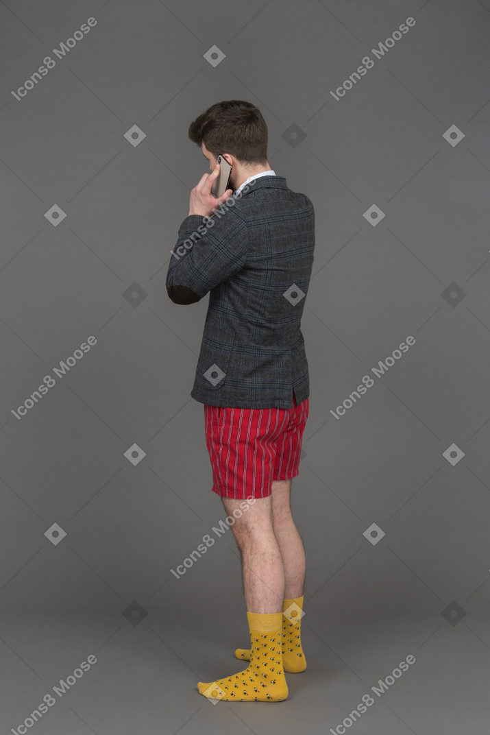 Man in red underwear talking on the phone