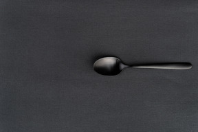 Black tea spoon in the dark