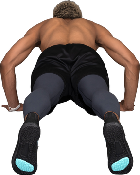 Vista traseira de um homem afro sem camisa fazendo flexões