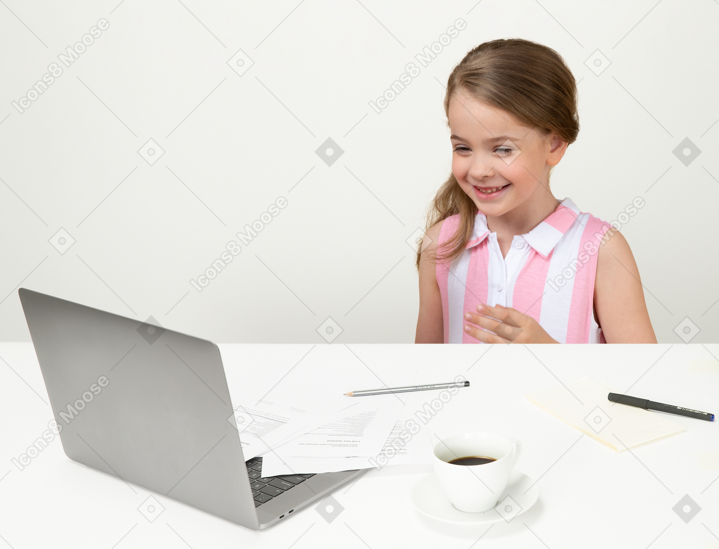 Little girl sitting at the office table