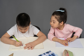 Boy and girl doing their homework