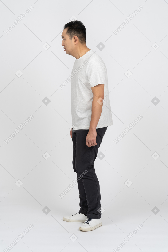 Side view of a scared man staring at something