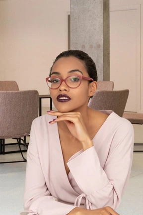 A woman sitting with her hand under her chin