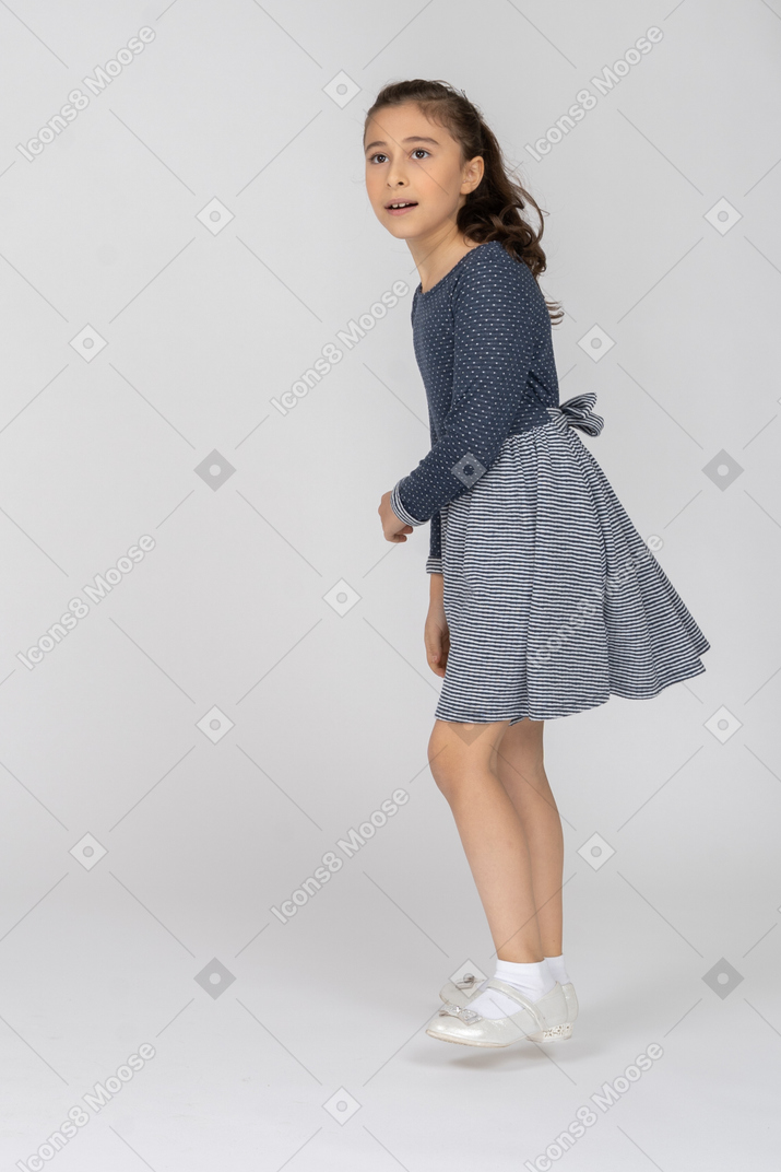 Side view of a girl stepping to the side in motion