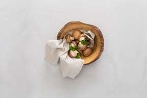 Mushrooms in wooden bowl and spices