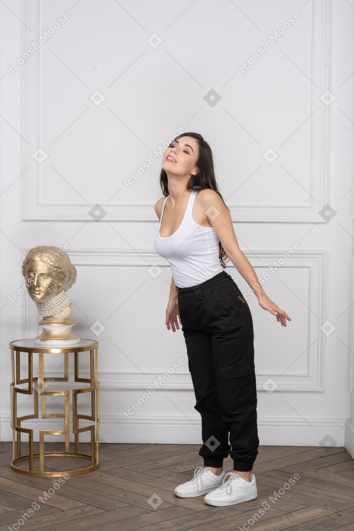 Woman looking relieved with arms behind back