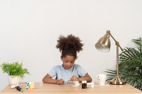 Good looking cute girl doing science at the table