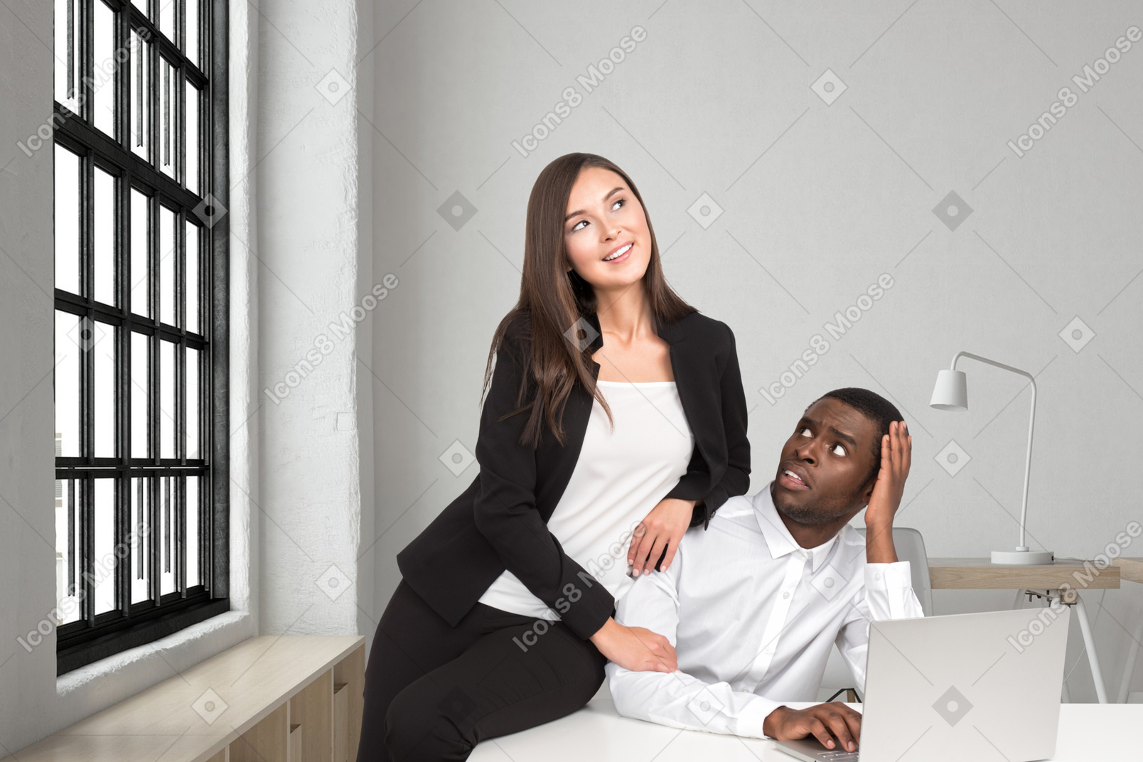 Woman leaning on confused colleague