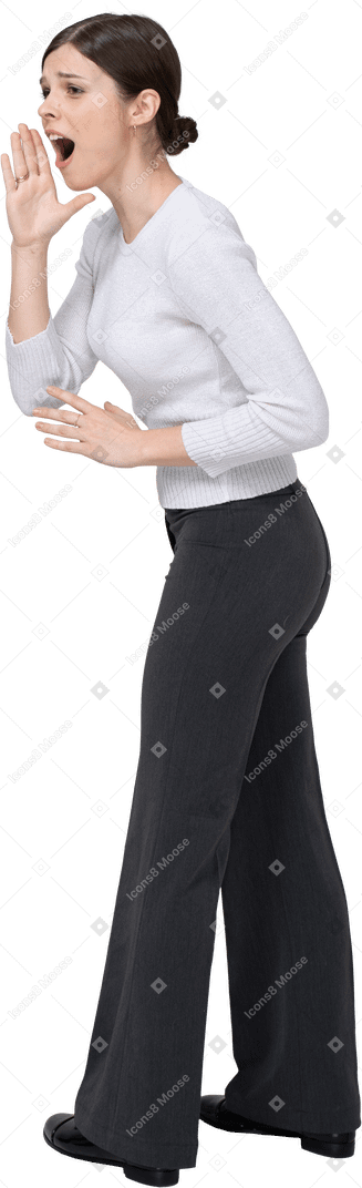Three-quarter back view of an emotional gesticulating young woman in office clothing