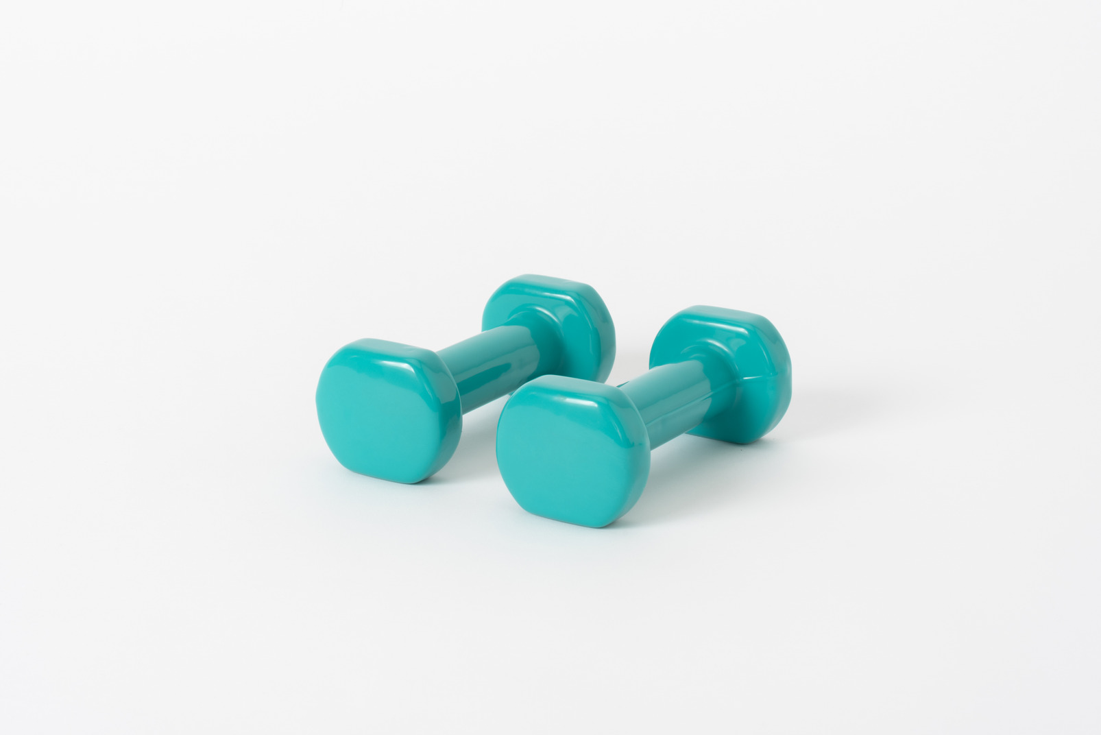 Two plastic toy dumbbells