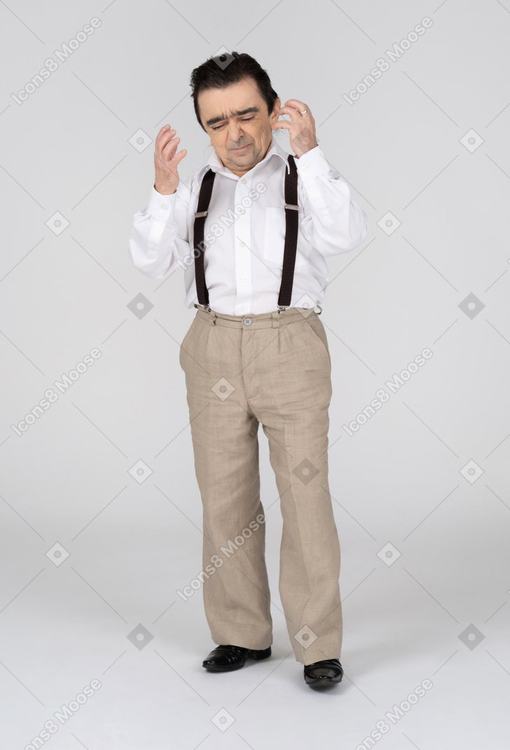 Man with closed eyes and raised hands