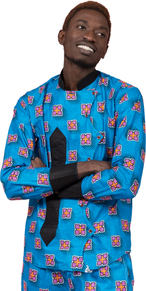 Black man in blue pajamas standing