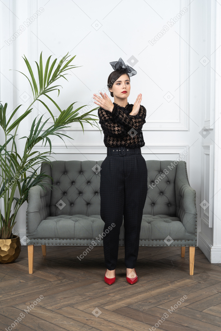 Woman crossing arms to express rejection