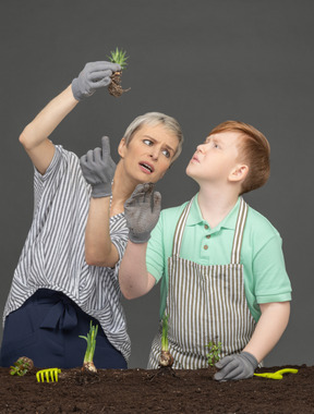 Mother and son gardening