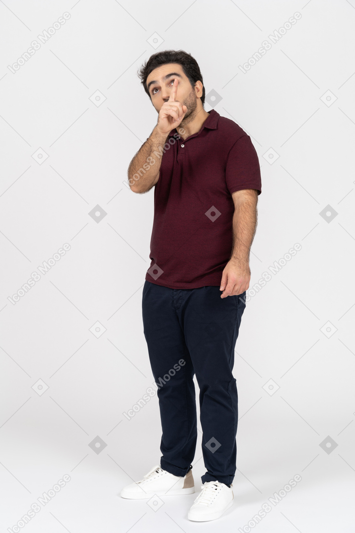Man in casual clothes pointing up