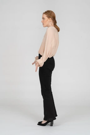 Woman in beautiful blouse standing