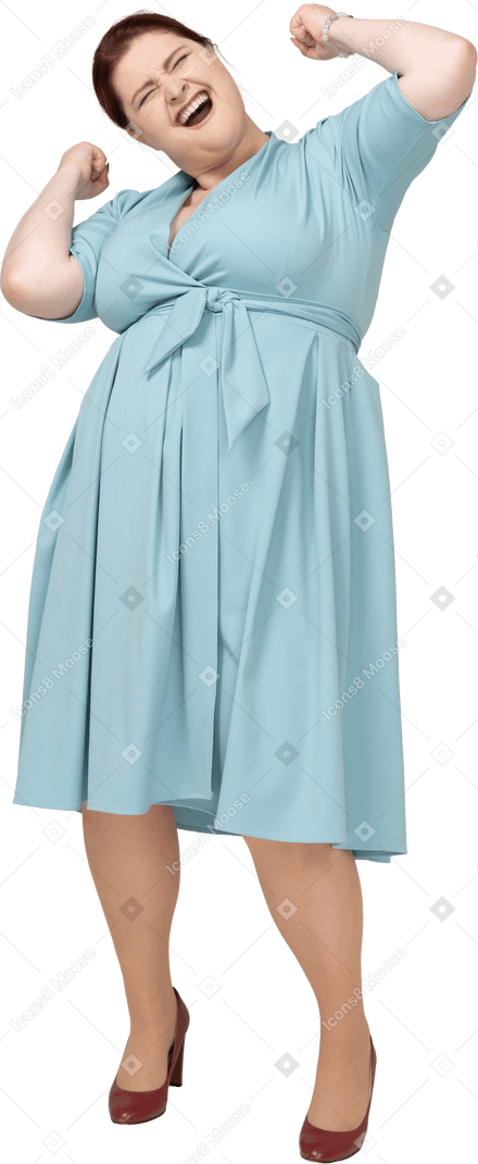 Front view of a happy woman in blue dress gesturing