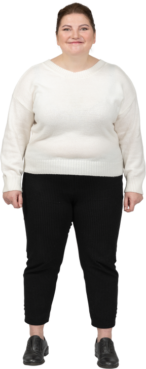 Plump woman in casual clothing looking at camera