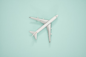 Airplane scale model on a turquoise background