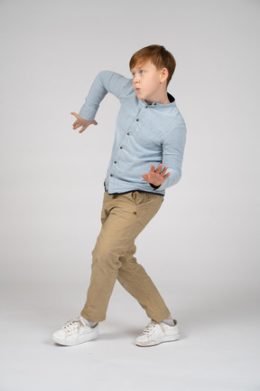 A young boy doing a dance