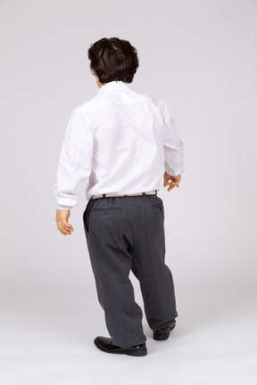 Back view of man leaning on one leg
