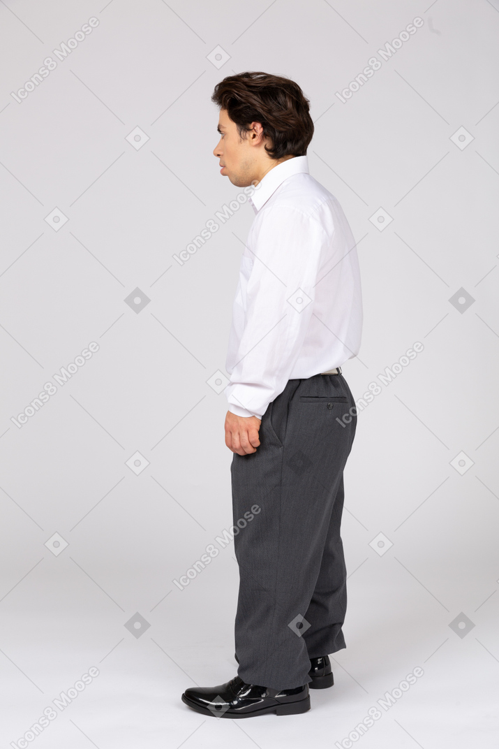 Side view of a male office worker looking aside