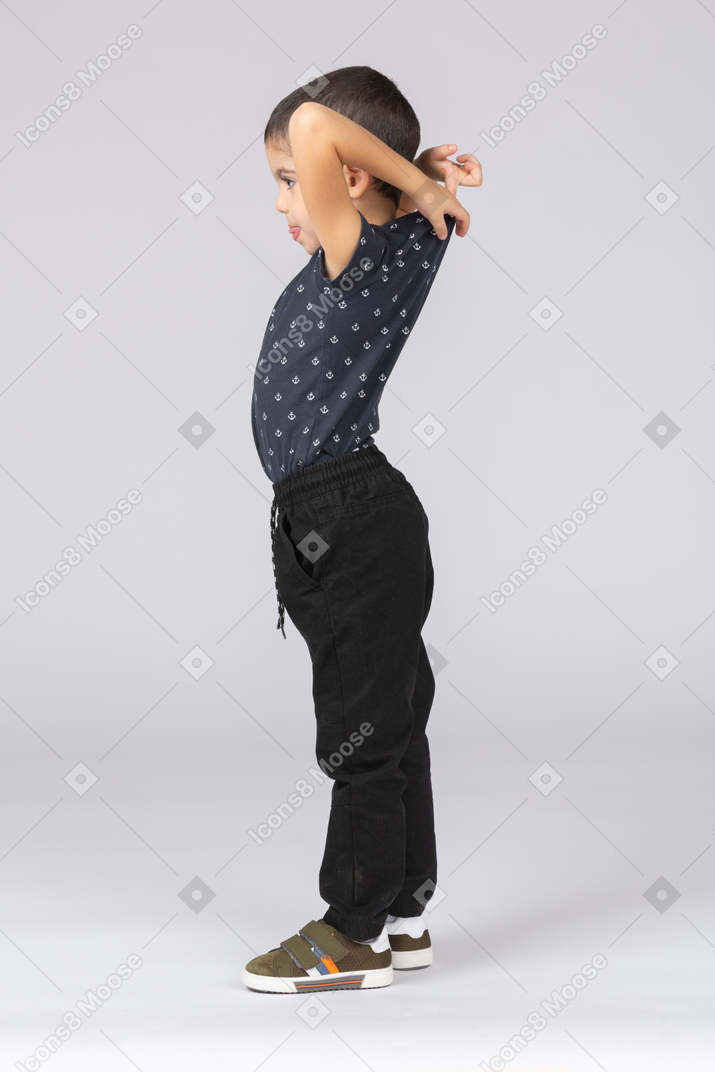 Side view of a boy stretching