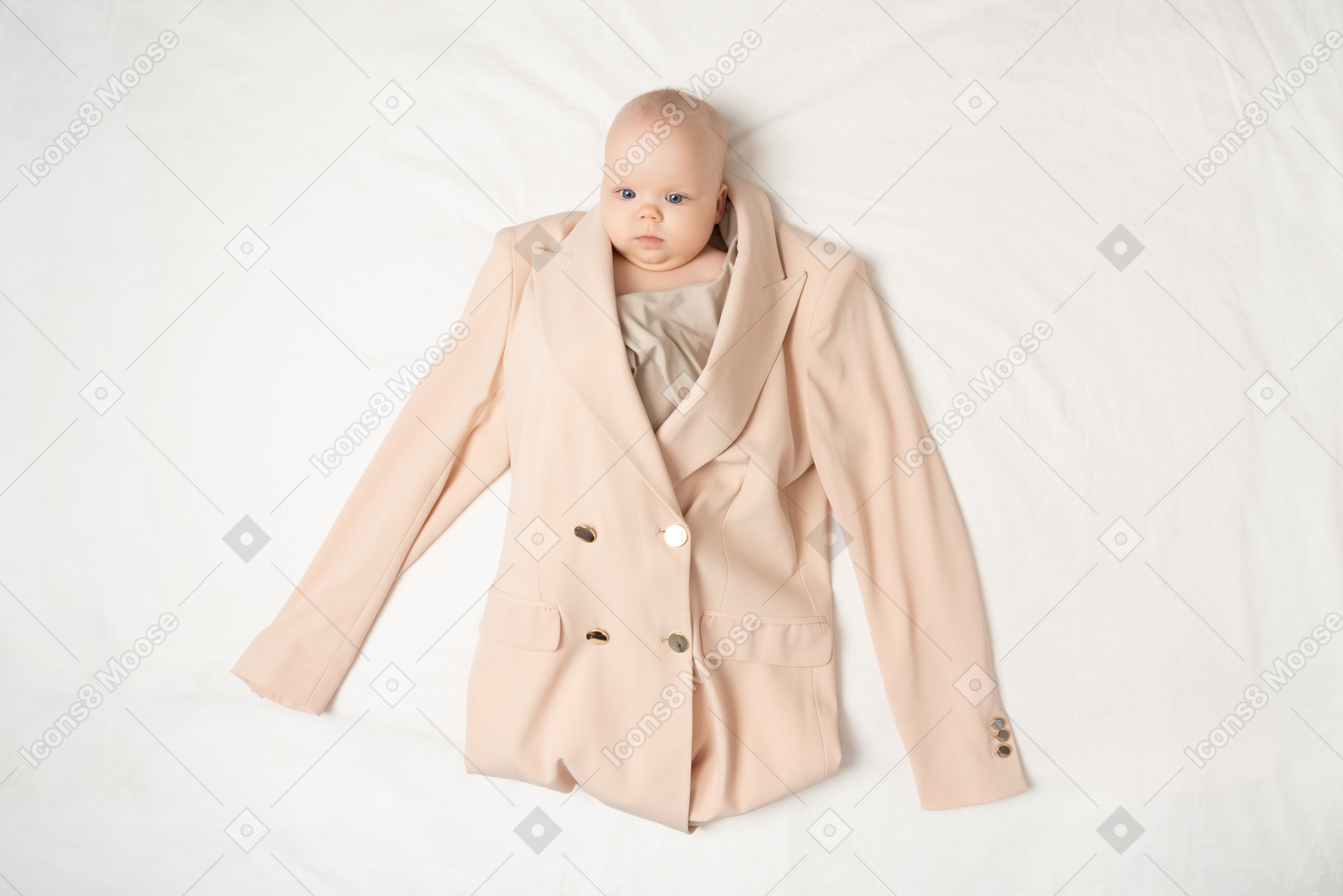 Baby girl in adult's jacket and blouse