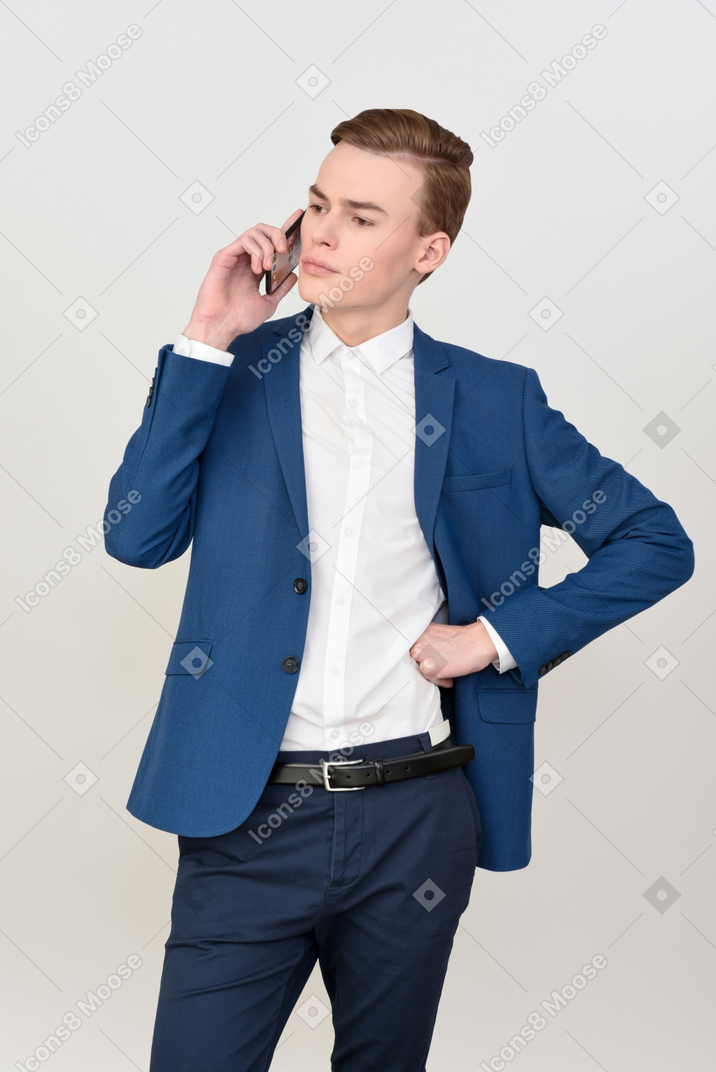 Handsome young man talking on the phone